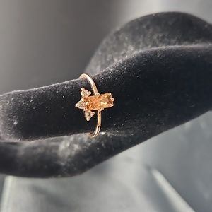 H-8 Rosegold tone ring with yellow stone and clear accents